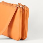 Solvetta — Women's Bright Tangerine Orange Smooth Genuine Leather Top-Zip Wide-Flat-Strap Hardware-Free Minimalist Chic Crossbody Bag - Image 4