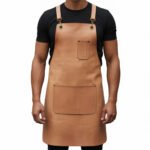 Chiaro Nobile — Men's Light Natural Buff Tan Genuine Full-Grain Cowhide Leather Heavy-Duty Adjustable Cross-Back Strap Antique Brass D-Ring Buckle Chest Pocket Large Front Multi-Pocket Chef Barber Blacksmith Craftsman Elegant Professional Workshop Utility Apron