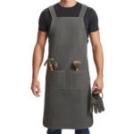 Oliva Guerriero — Men's Olive Army Grey Genuine Waxed Heavy-Duty Canvas with Dark Leather Cross-Back Shoulder Strap No-Buckle Slip-Over Design Dual Large Front Tool Pocket Hammer Loop Brush Holder Chef Barber Blacksmith Carpenter Woodworker Craftsman Rugged Field Workshop Utility Apron