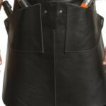 Nero Maestro — Men's Jet Black Genuine Smooth Glossy Full-Grain Cowhide Leather Heavy-Duty Adjustable Thin Cross-Back Shoulder Strap Black Hardware Clip Fastening Clean Minimal Bib Front Dual Deep Side Tool Pocket Scissor Holder Comb Slot Barber Hairdresser Stylist Chef Tattoo Artist Craftsman Sleek Professional Salon Workshop Utility Apron - Image 2