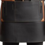 Bicolore Stratega — Men's Jet Black Waxed Canvas Body Tan Cognac Genuine Full-Grain Cowhide Leather Two-Tone Contrast Heavy-Duty Adjustable Black Cross-Back Strap Antique Brass Buckle Large Tan Leather Chest Flap Pocket Multiple Side Tool Loop Knife Holder Wide Lower Canvas Panel Gathered Waistband Chef Barber Blacksmith Carpenter Craftsman Bold Two-Tone Professional Workshop Utility Apron - Image 2