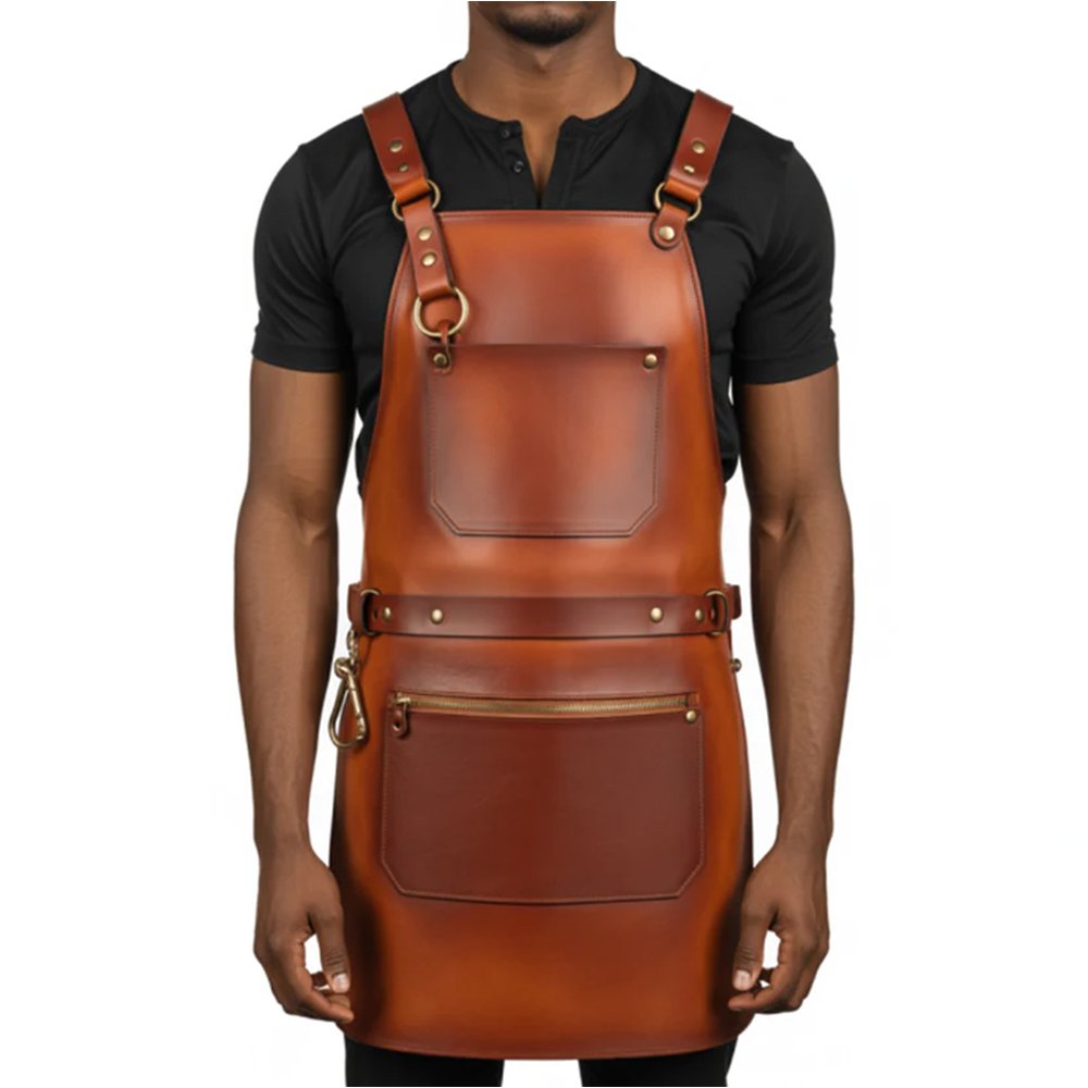 D59 Ambra Lusso — Men's Rich Amber Honey Cognac Tan Genuine Hand-Patina Burnished Full-Grain Cowhide Leather Heavy-Duty Adjustable Cross-Back Strap Gold O-Ring Hardware Large Upper Chest Pocket Dual Lower Zipper Pocket Gold Zipper Pull Contrast Edge Stitch Sleek Structured Design Chef Barber Sommelier Stylist Craftsman Refined Luxury Professional Salon Restaurant Workshop Utility Apron - Image 1