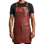 Castagno Bottega — Men's Rich Chestnut Brown Genuine Full-Grain Cowhide Leather Heavy-Duty Adjustable Cross-Back Strap Silver-Tone Clip Buckle Zip Chest Pocket Large Front Pocket Chef Barber Woodworker Craftsman Professional Workshop Utility Apron