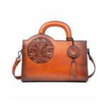 Fiorazza — Women's Cognac Brown Genuine Leather Floral Embossed Round Handle Tassel Crossbody Shoulder Handbag
