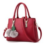 Pomponazza — Women's Deep Cherry Red Genuine Leather Gold-Tone Hardware Fur Pom-Pom Charm Double Top Handle Crossbody Shoulder Handbag